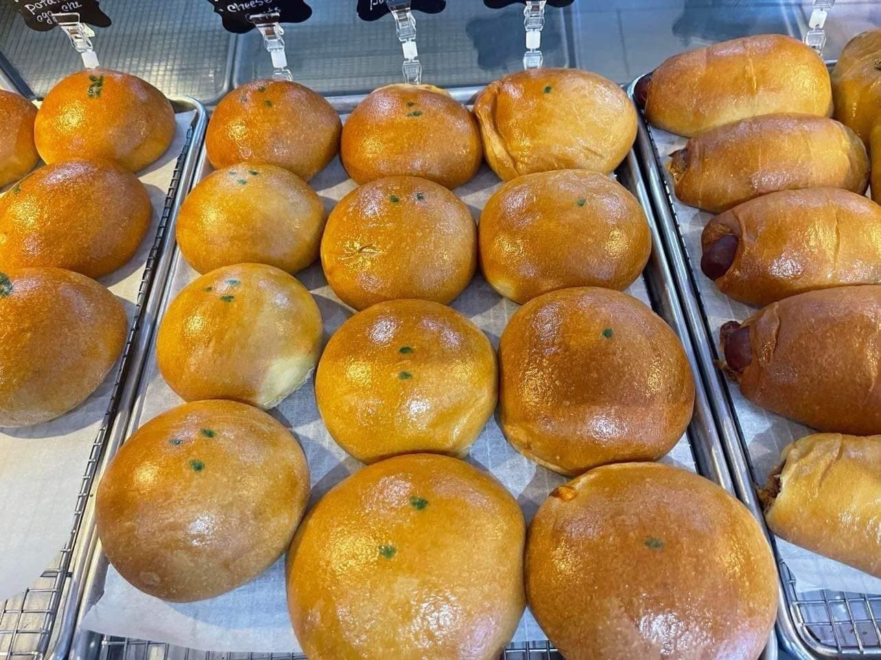 Fresh kolaches on trays in the BEST KOLACHE display case